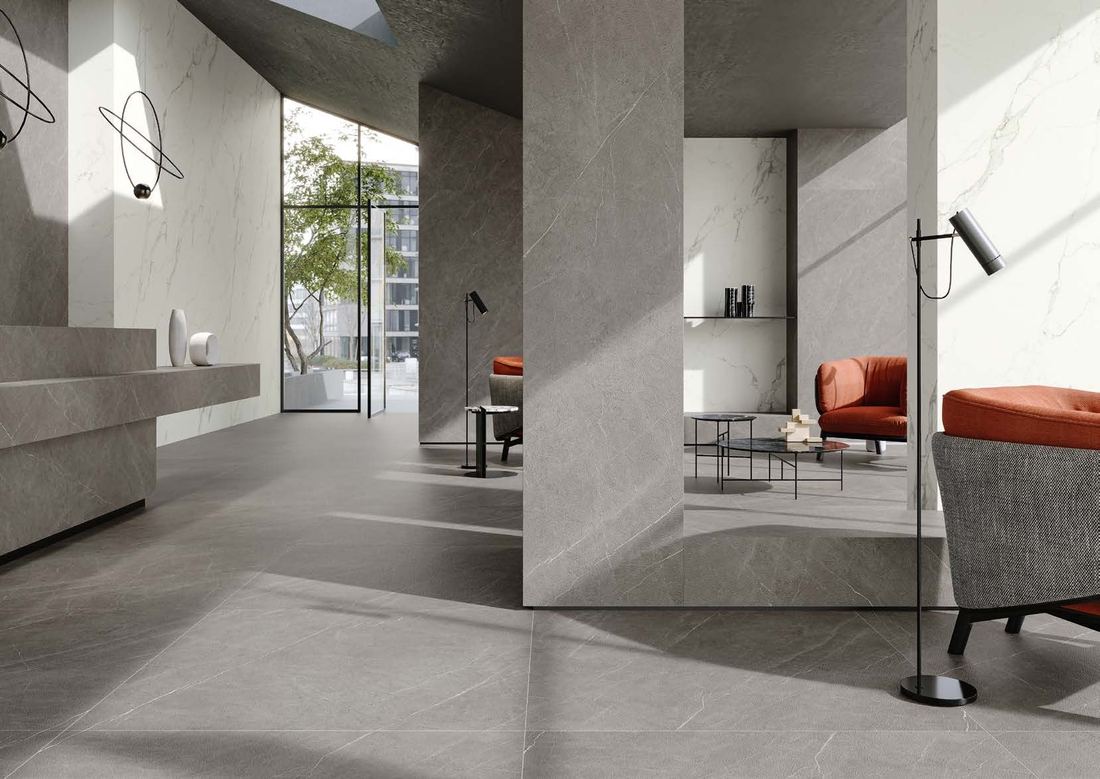 Large-format marble slabs in an open living space — IDC Mohali